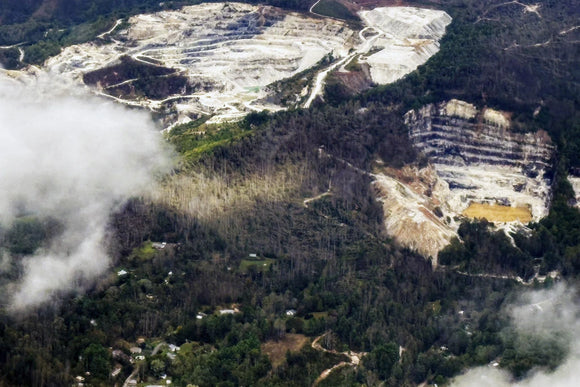 An aerial view of quartz mines in Spruce Pine, N.C., as taken from a plane on Monday, Sept. 30, 2024. (AP Photo/Gary D. Robertson)